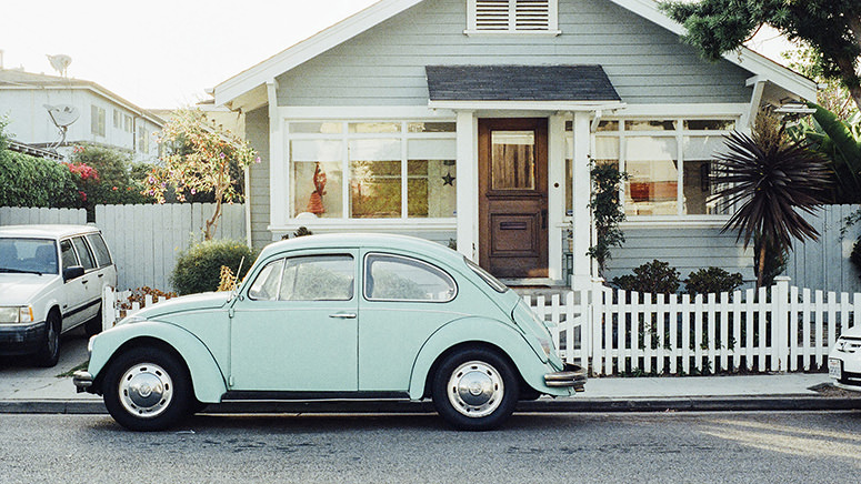 house with vw bug in front